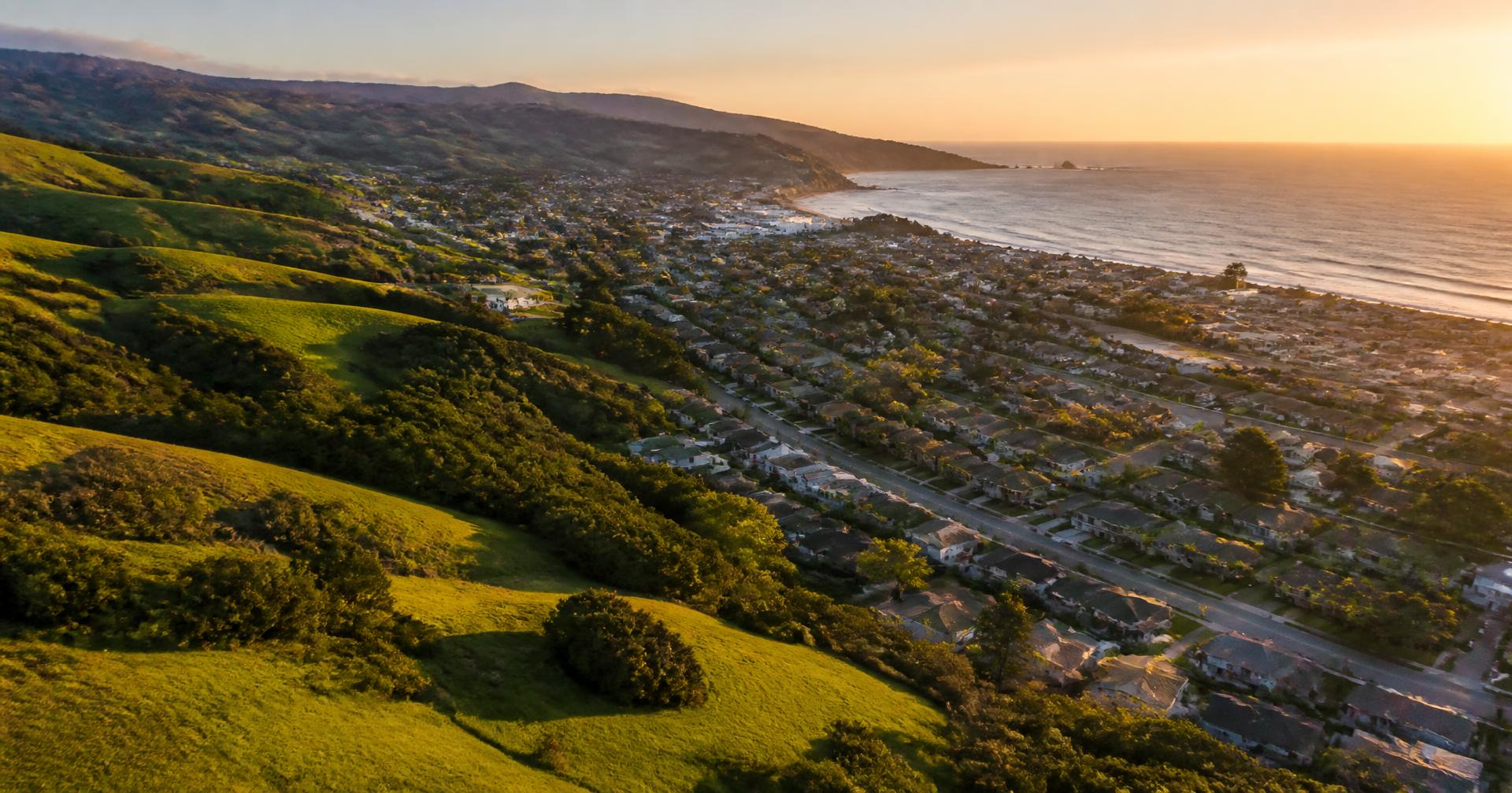 Golden hour over a Central Coast neighborhood between the hills and the Pacific
